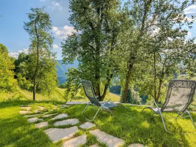 two chairs sitting on the grass in a field at Nature Hideaway Holiday Homes with Sauna - One Bedroom Holiday Home in Slappe dʼIdria