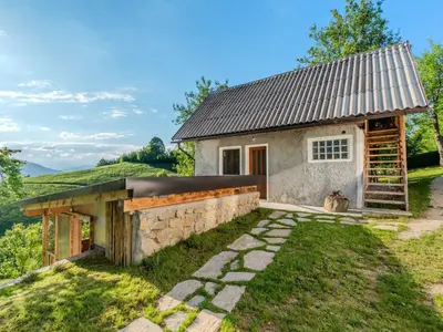 a stone house with a metal roof and a stone wall at Nature Hideaway Holiday Homes with Sauna - One Bedroom Holiday Home in Slappe dʼIdria