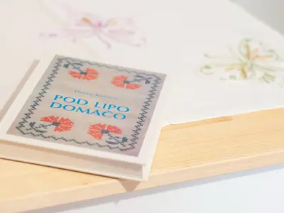 a book sitting on top of a wooden table at Sunny Two Bedroom Retreat in Beautiful Bizeljsko - Two Bedroom Country House in Bizeljsko