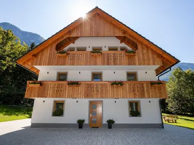 a building with a wooden roof at The Woodland Nook Apartments Bohinj - Comfort Two Bedroom Apartment with Balcony in Bohinj