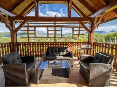 a screened in porch with two chairs and a table at One Bedroom Holiday Home with Terrace and Garden in Krška Vas