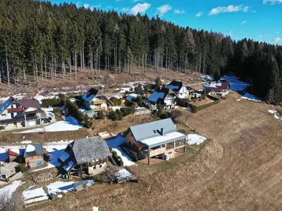 an aerial view of a small village in the woods at Mountain Vibrant and Timeless Apartment with Sauna - Studio Apartment with Terrace in Dravograd