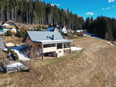 an aerial view of a house on a hill at Mountain Vibrant and Timeless Apartment with Sauna - Studio Apartment with Terrace in Dravograd