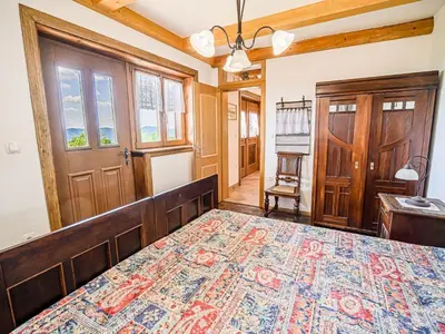 a bedroom with a large bed in a room at Hidden Authentic Haven Apartments - Two Bedroom Apartment with Balcony in Sevnica