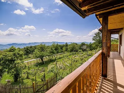 a balcony of a cabin with a view of a farm at Hidden Authentic Haven Apartments - Two Bedroom Apartment with Balcony in Sevnica