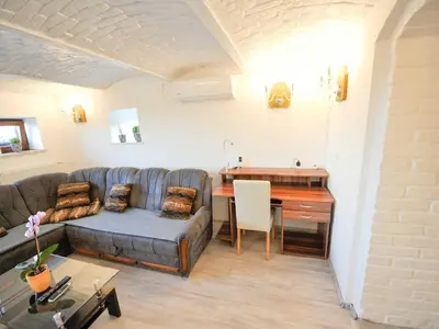 a living room with a couch and a table at Relax and Rustic Apartments with Terrace - Classic One Bedroom Apartment with Terrace in Brežice