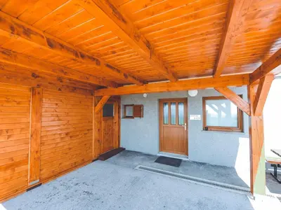 a large room with a wooden ceiling and a door at Relax and Rustic Apartments with Terrace - Classic One Bedroom Apartment with Terrace in Brežice