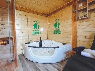 a bathroom with a tub in a wooden cabin at Relax and Rustic Apartments with Terrace - Classic One Bedroom Apartment with Terrace in Brežice