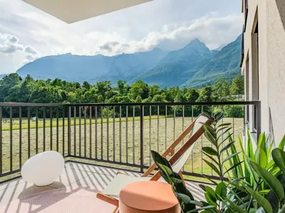 a balcony with a view of the mountains at Bovec Chic Apartment with Sauna - One Bedroom Apartment with Balcony in Bovec