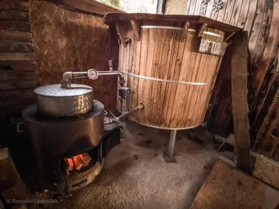 a kitchen with a pot on top of a stove at Rustic Refuge Glamping with Hot-Tub and Sauna - Two Bedroom Apartment with Terrace in Zreče