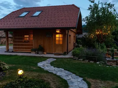 a small cabin with a pathway in front of it at Echo Valley Hillside Holiday Home with Sauna - Two Bedroom Holiday Home with Sauna in Ribnica