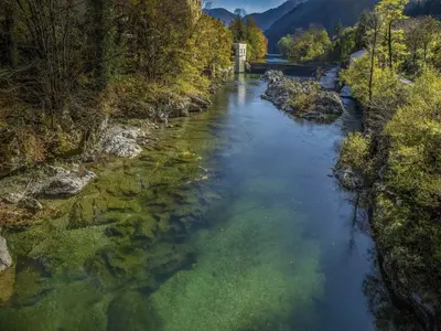 an aerial view of a river with trees and a bridge at Riverside Rustic Ridge Apartments with Balcony - Two Bedroom Apartment with Balcony in Slappe dʼIdria