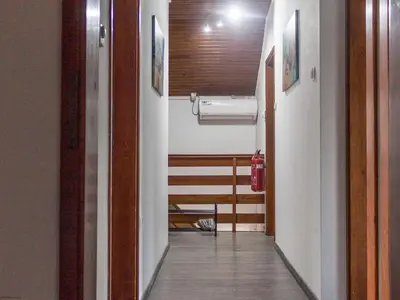 a hallway leading to a room with a fire hydrant at Two Bedroom Apartment in Rečica ob Savinji