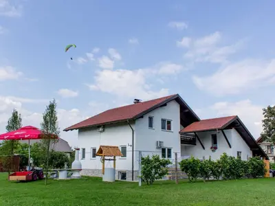 a white house with a red roof at Two Bedroom Apartment in Rečica ob Savinji