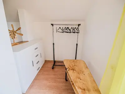a kitchen with a wooden table in a room at Harvest Horizon Holiday Home with Sauna - One Bedroom Holiday Home in Brežice
