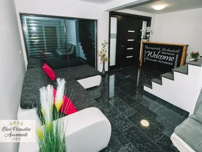 a living room with a couch and some chairs at Bled Prestigious and Stylish Apartments - Classic Studio Apartment with Terrace in Bled