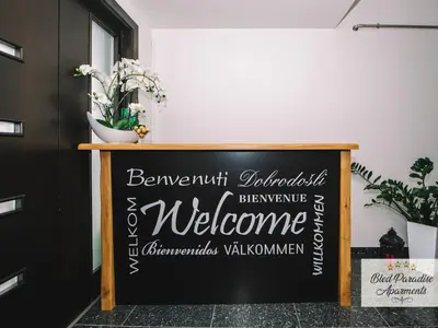 a chalkboard sign in a room with a welcome sign at Bled Prestigious and Stylish Apartments - Classic Studio Apartment with Terrace in Bled