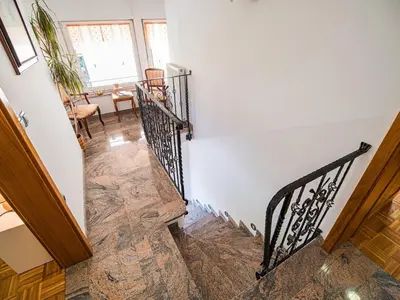 a staircase in a home with a stair case at Sunny and Comfortable Apartment with Terrace and Garden - Two Bedroom Apartment with Terrace in Rečica ob Savinji