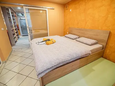 a bedroom with a bed and a walk in shower at Elegant and Stylish Retreat Apartments with Terrace - Two Bedroom Apartment with Terrace in Brežice