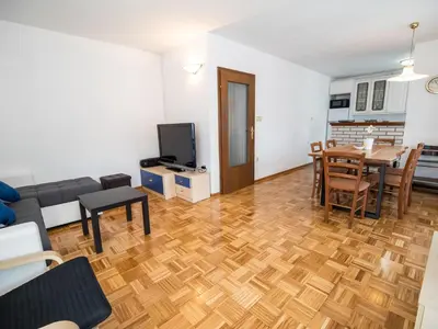 a living room with a couch and a table at Mountain View Haven Apartments - Two Bedroom Apartment with Balcony in Bovec