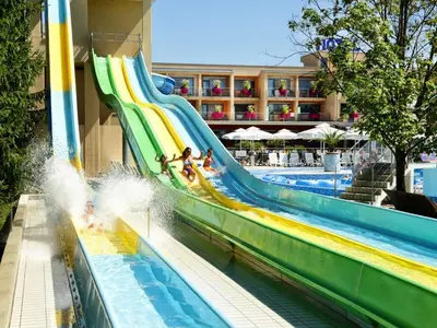 a water slide in a pool at a resort at Stylish Retreat with BBQ and Modern Amenities near Terme - Three Bedroom Apartment in Dobova