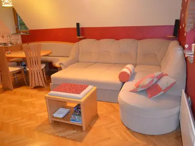 a living room with a couch and a table at Two Bedroom Apartment with Balcony in Kranjska Gora