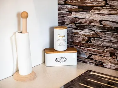 a bottle of soap and a candle on a counter at City Modern and Vibrant Apartments Ljubljana - Standard One Bedroom Apartment in Ljubljana