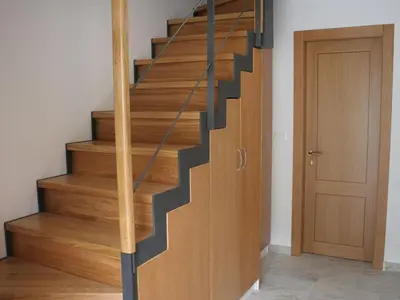 a staircase with wooden treads and a wooden door at Riverside Rustic Ridge Apartments with Balcony - Three Bedroom Apartment with Balcony in Slappe dʼIdria