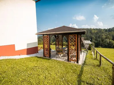 a gazebo with a table in a field at Bloomfield Retreat Country House with Sauna - Three Bedroom Country House in Rečica ob Savinji