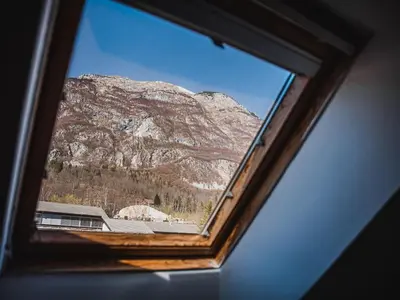 a view of a mountain from a window at Bovec Picturesque Mountain Vista Residences - Two Bedroom Apartment in Bovec