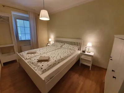 a bedroom with a large bed and a window at Komen Getaway Holiday Home with Balcony - Four Bedroom Holiday Home with Balcony in Komen