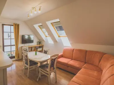 a living room with a couch and a table at Comfortable Apartment with Mountain View - One Bedroom Apartment in Bovec