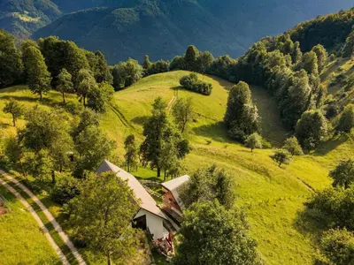 an aerial view of a house on a green hill at Nature Hideaway Holiday Homes with Sauna - Two Bedroom Holiday Home in Slappe dʼIdria