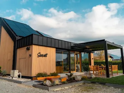 a small building with a solarium on it at Elegant Warm Bliss Hideaway Escape Lodge - Holiday Home with Hot-Tub in Šenčur