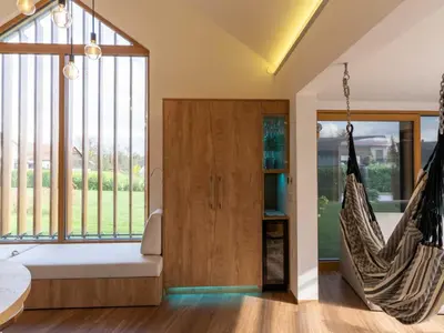 a bedroom with a swinging bed and a hammock at Elegant Warm Bliss Hideaway Escape Lodge - Holiday Home with Hot-Tub in Šenčur