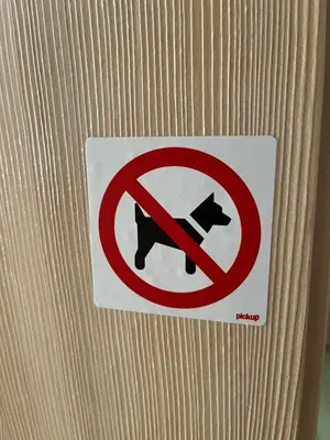 a no dogs allowed sign on a wooden door at Triglav NP Apartment - above Bled in Zgornje Gorje