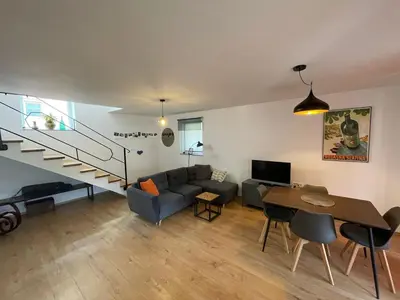 a living room with a couch and a table at Spacious 2 bed Villa near Spa Town Rogaska Slatina in Rogaška Slatina