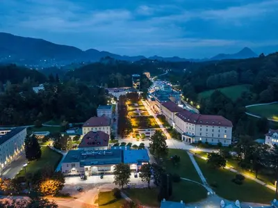 a town lit up at night with buildings and street lights at Spacious 2 bed Villa near Spa Town Rogaska Slatina in Rogaška Slatina