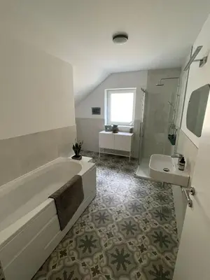 a bathroom with a tub and a sink at Spacious 2 bed Villa near Spa Town Rogaska Slatina in Rogaška Slatina