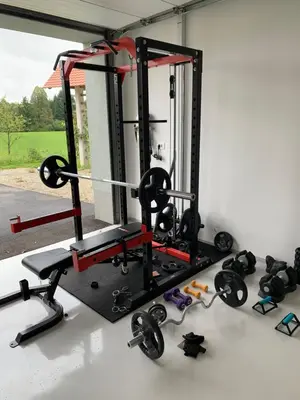 a gym with weights and dumbbells on a table at Hiša nad izvirom reke Krke in Krka