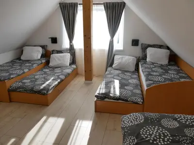 a room with two beds and a window at Hidden View House