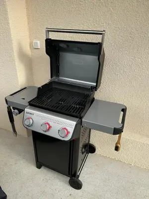 a bbq grill sitting next to a wall at Hidden View House