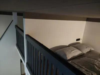 a bed in the corner of a room at Apartma Fontana in Ljubljana