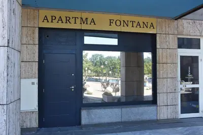a entrance to a building with a blue door at Apartma Fontana in Ljubljana