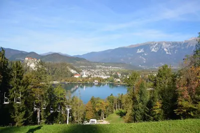 a view of a lake with mountains in the background at Lake Bled Holiday Home in Bled