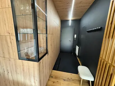 a room with a hallway with a chair and a door at Apartment Kranjska Gora Diamond in Kranjska Gora