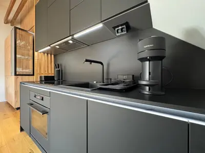 a kitchen with a coffee machine on a counter at Apartment Kranjska Gora Diamond in Kranjska Gora