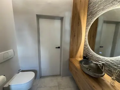 a bathroom with a sink and a mirror at Apartment Kranjska Gora Diamond in Kranjska Gora