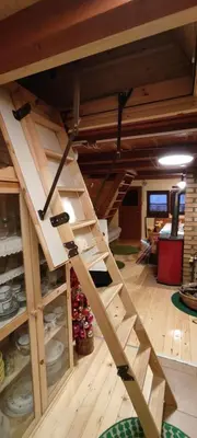 a staircase in a room with wooden floors at The house at the larssen in Šmartno pri Slovenj Gradcu