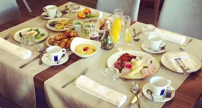 a table with plates of food on top of it at Gostišče Iršič in Slovenska Bistrica